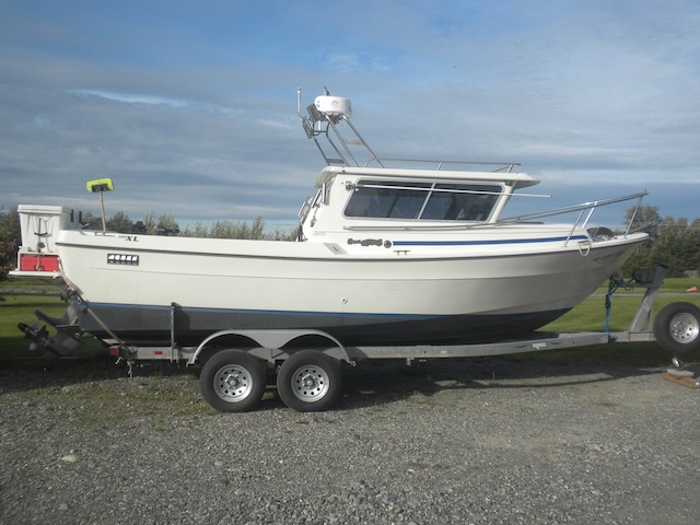 REDUCED TO $59,500! 1999 24' SeaSport Limited. 200 HP Volvo 41P diesel out-drive. Dual station, drum windlass, heat, kicker, new #5,000 trailer Axles