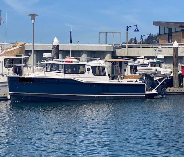 WOW! 2023 Ranger Tug R-27.  300 HP Yamaha, 320 Hours, Heat, Trailer, VERY CLEAN BOAT.  $235,000